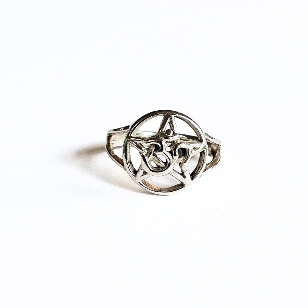 A sterling silver ring featuring the om pentacle symbol.