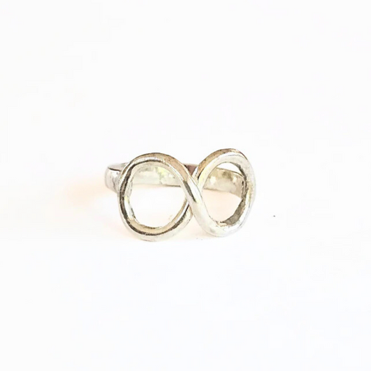 A sterling silver infinity symbol ring on a white background.