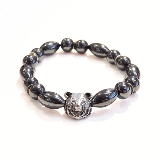A silver-colored Pain Relief Intention Bracelet with a bear charm in the center, displayed against a white background.