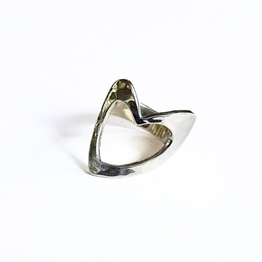 A sterling silver ring with an open heart design, showing a hollowed-out center and a smooth, polished finish.