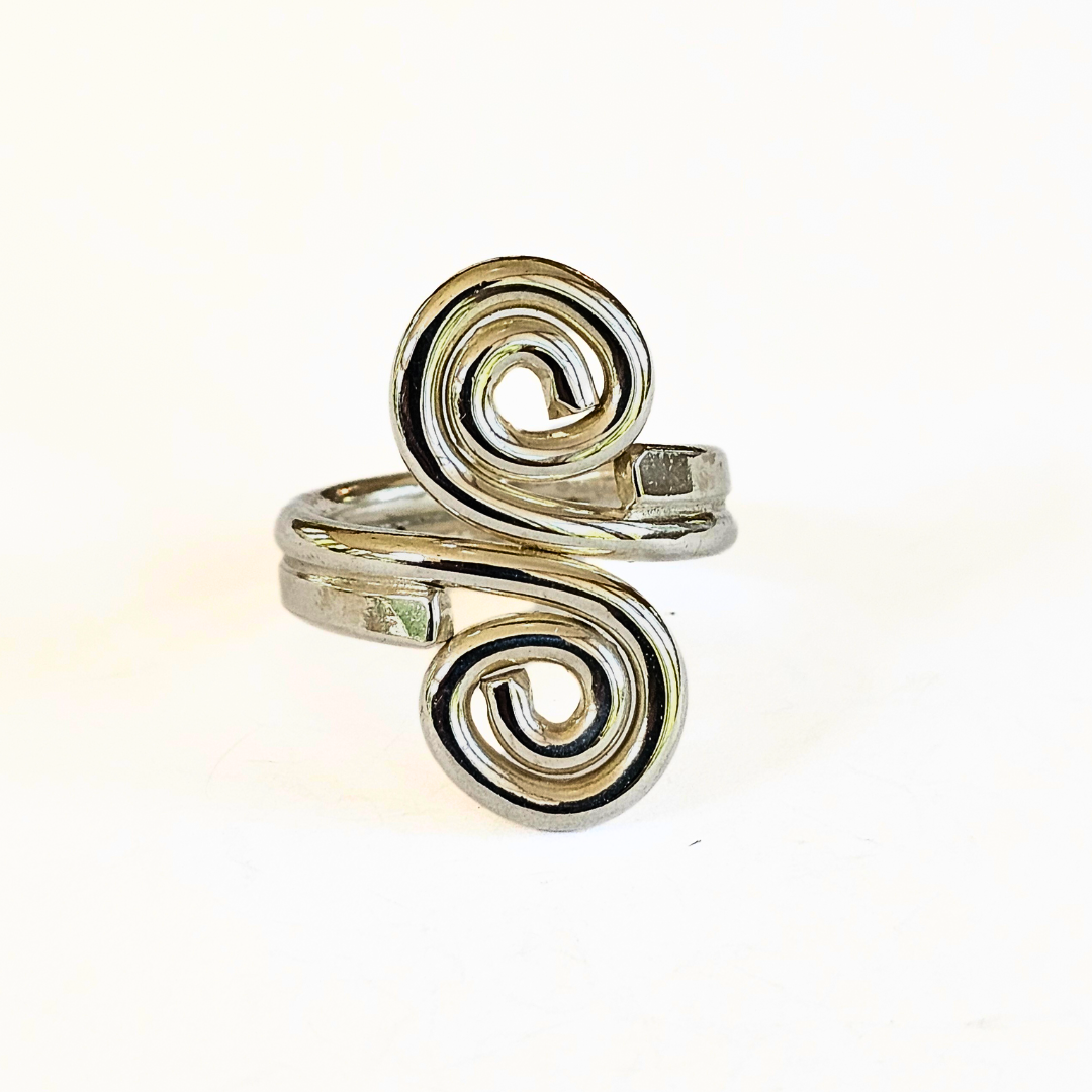 A sterling silver ring with a swirl design, capturing elegant movement and timeless sophistication.