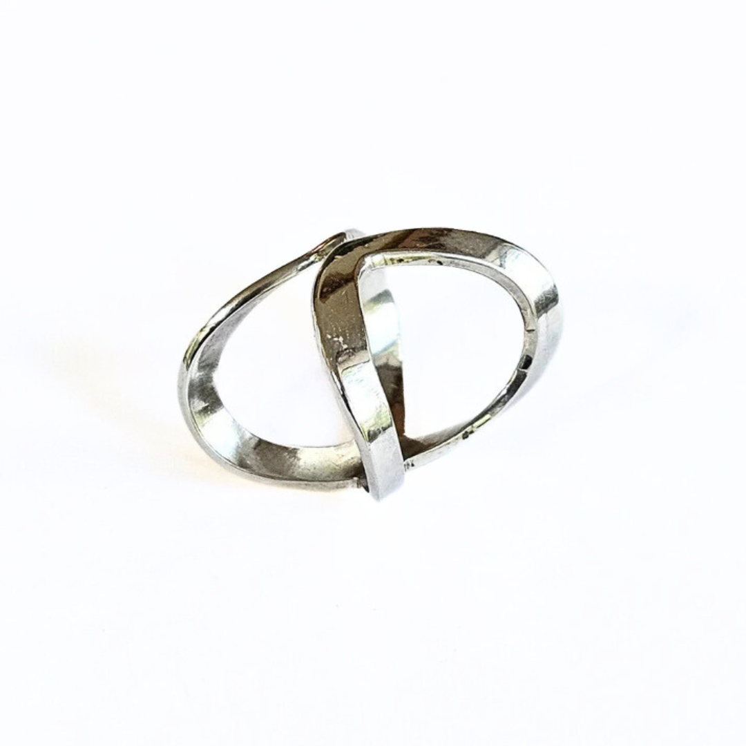 A sterling silver ring with a unique X-shaped design, displayed against a white background.